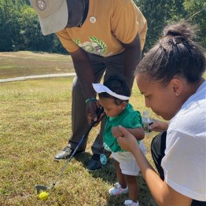 Baby and Mom With Golf Club